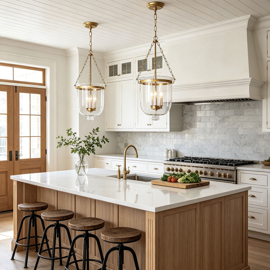 Glass chandeliers for dining room hanging above a kitchen island in a contemporary farmhouse space.