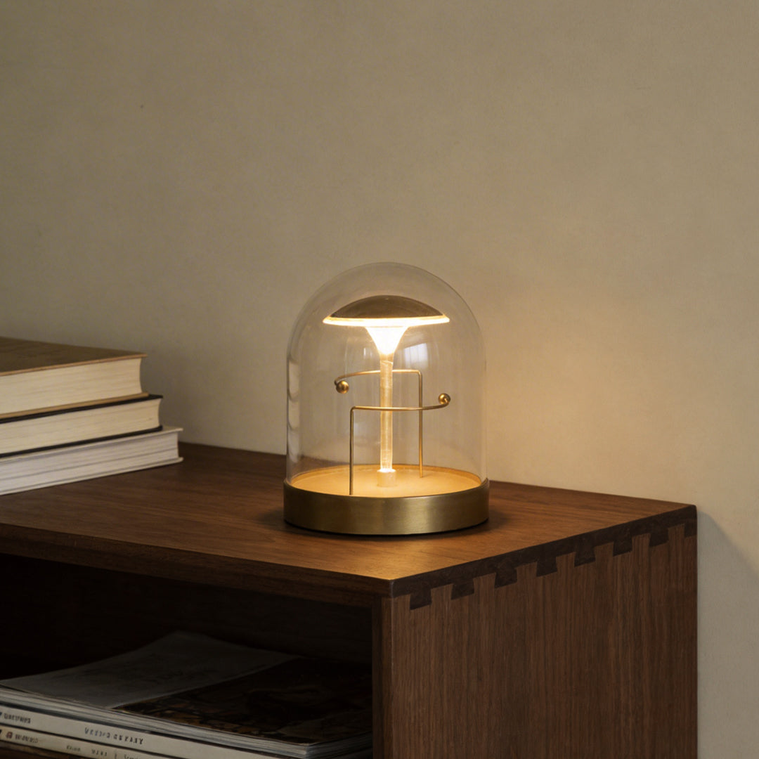Glass dome LED lights with a minimalist design, enhancing a wooden side table.