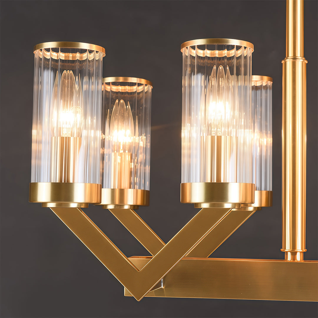 Modern luxury chandeliers close-up showcasing brass framework and glass cylinder detail