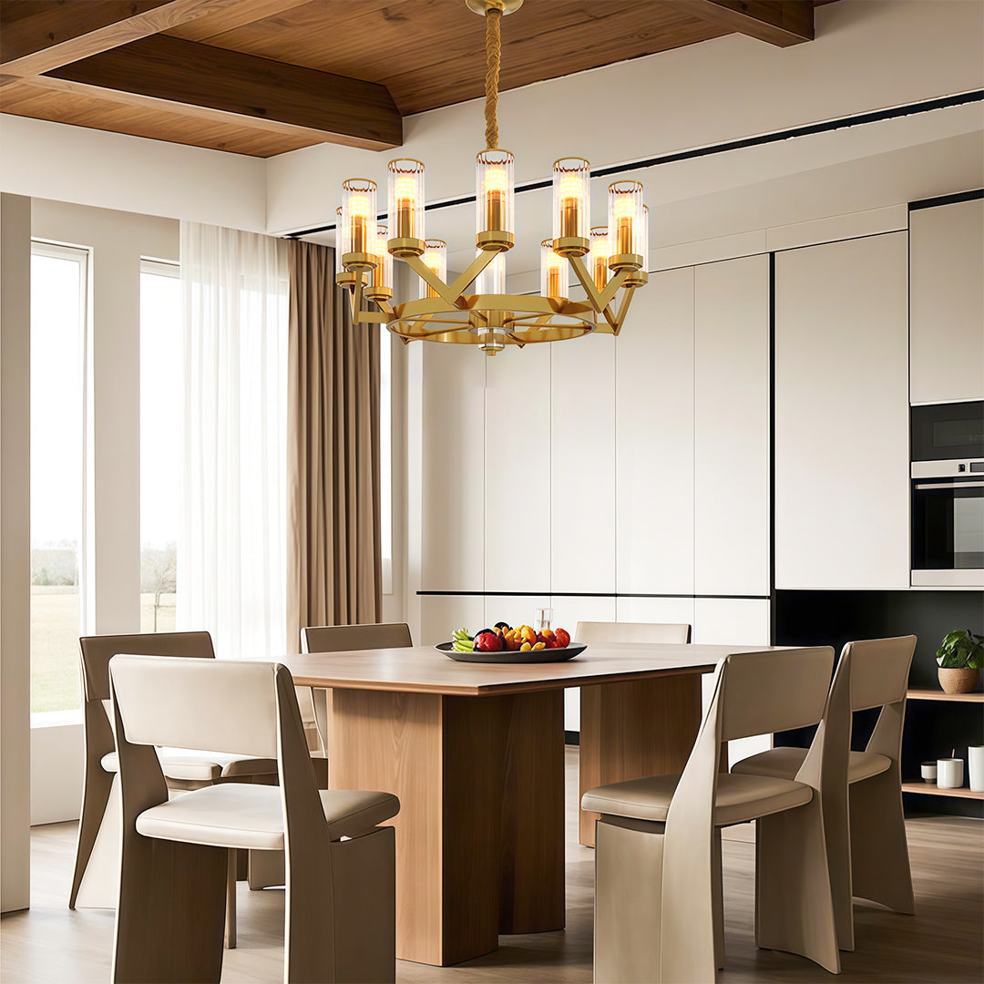 Modern luxury chandeliers illuminating contemporary dining room with brass table and neutral chairs
