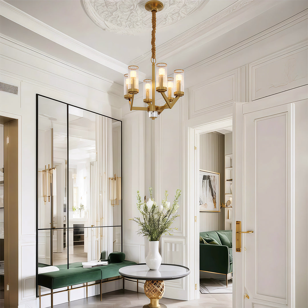 Modern luxury chandeliers lighting elegant dining space with neutral palette and artwork