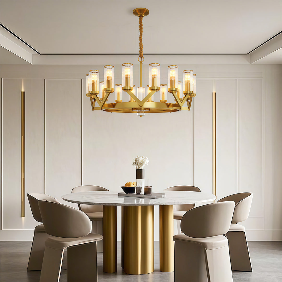 Glass drop chandelier creating focal point in minimalist dining space with fluted table