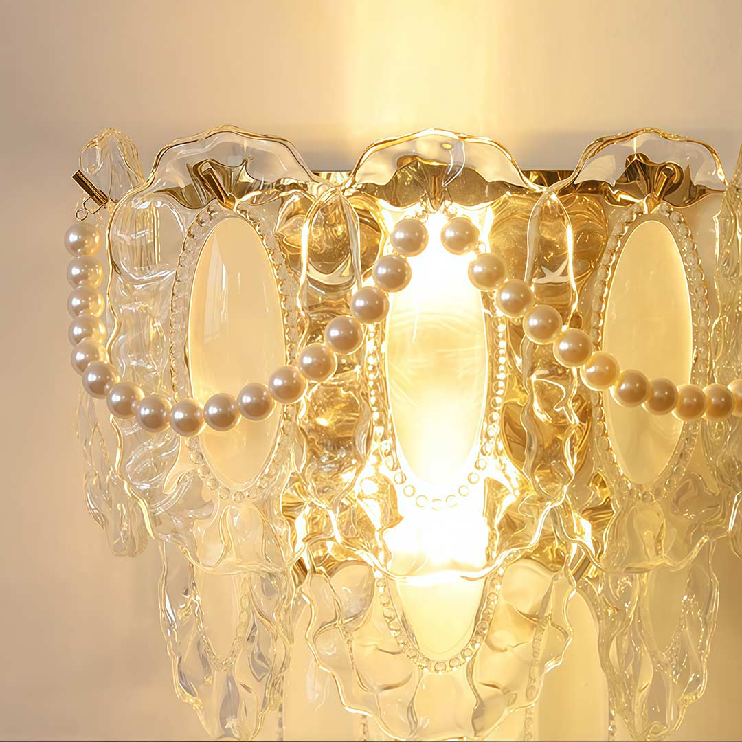 Glass feather wall light with a detailed feather design, hanging above a fireplace.