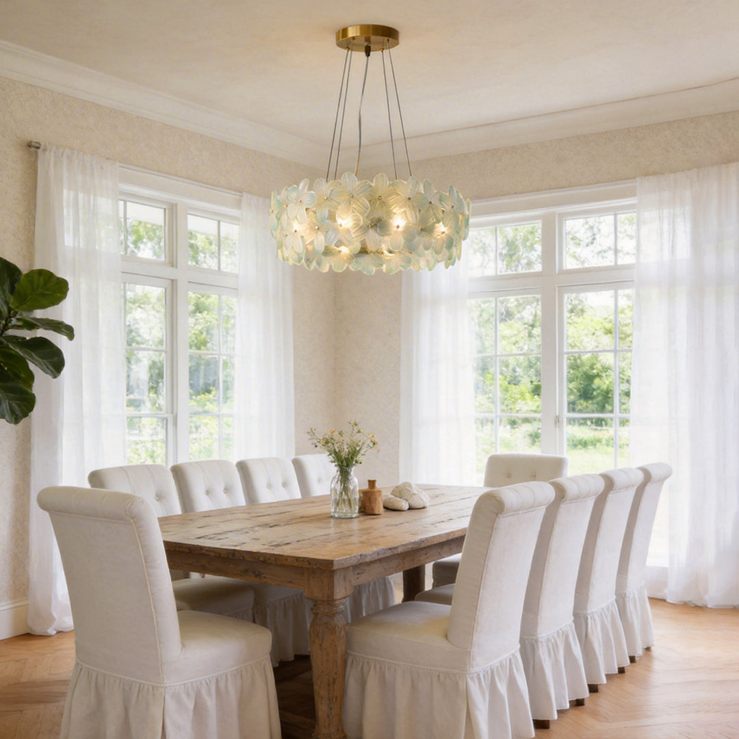 Glass flower chandelier with delicate pastel petals, illuminating a cozy dining room.