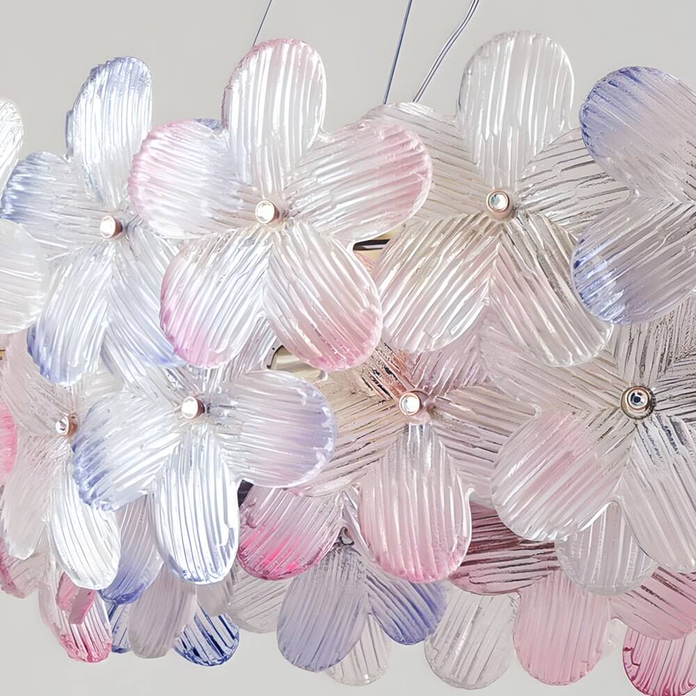 Glass flower chandelier with a sleek design, providing soft light in a living room.