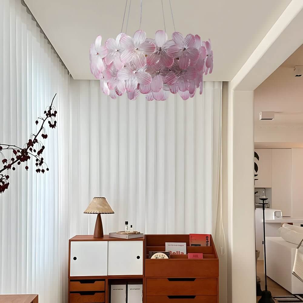 Glass flower chandelier with a soft pastel design, providing ambient light in a bedroom.