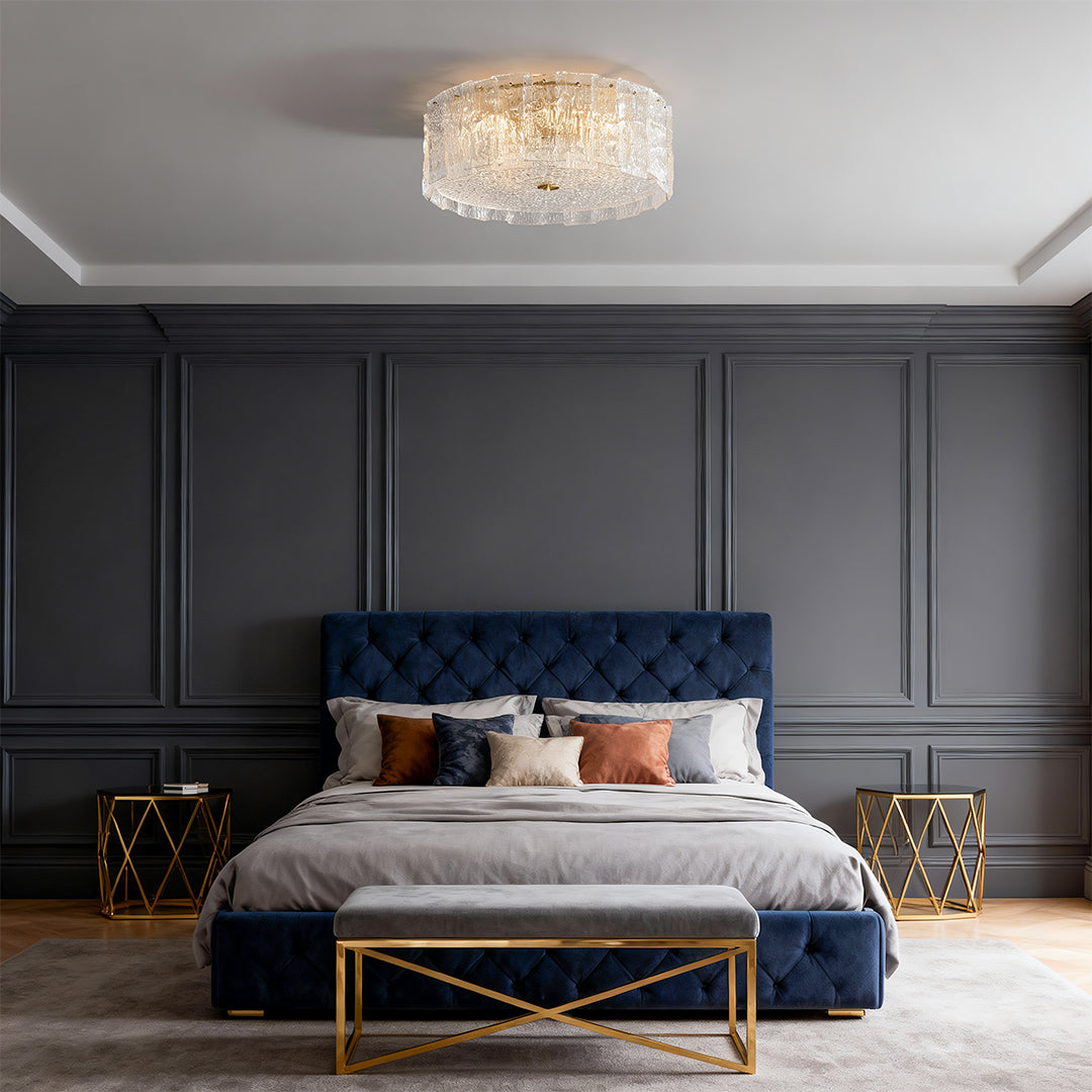 Glass flush mount lighting enhancing sophisticated bedroom with navy upholstered bed and paneled walls