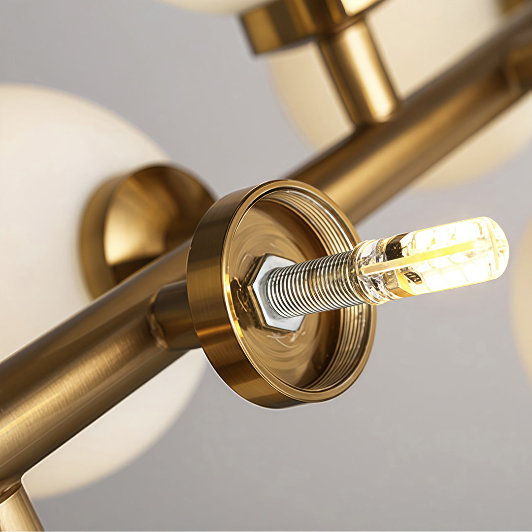 glass-globe-linear-chandelier-brass-side-view-geometric-design