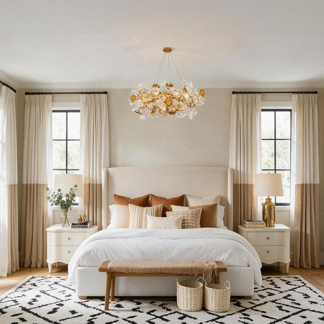 Glass leaf chandelier hanging above a bright bedroom with warm decorative illumination.