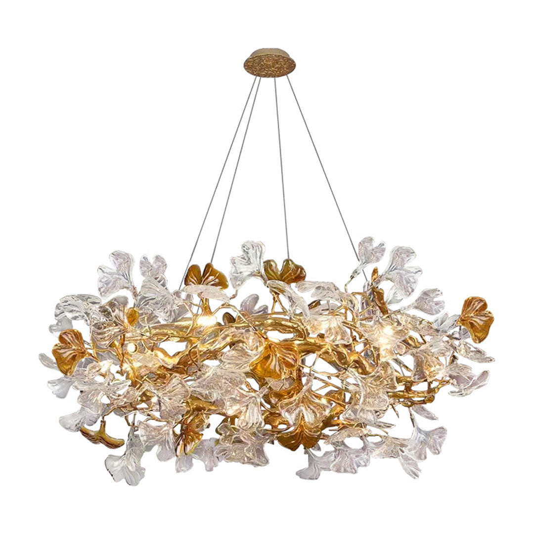 Glass leaf chandelier with dense clear and amber glass leaves arranged around a gold metal frame.