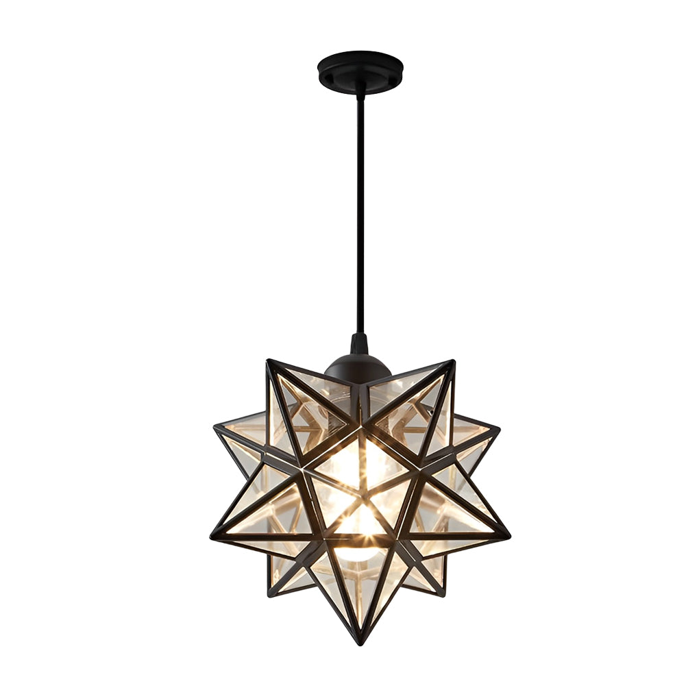 Black-framed glass Moravian star pendant light hanging in a cozy indoor space with soft lighting.