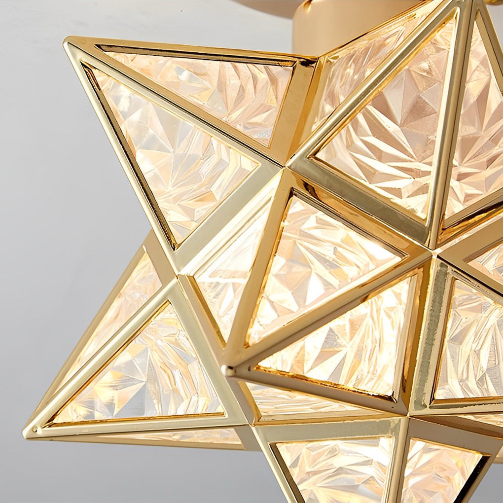 Close-up of a detailed glass Moravian star pendant light showcasing intricate geometric patterns.