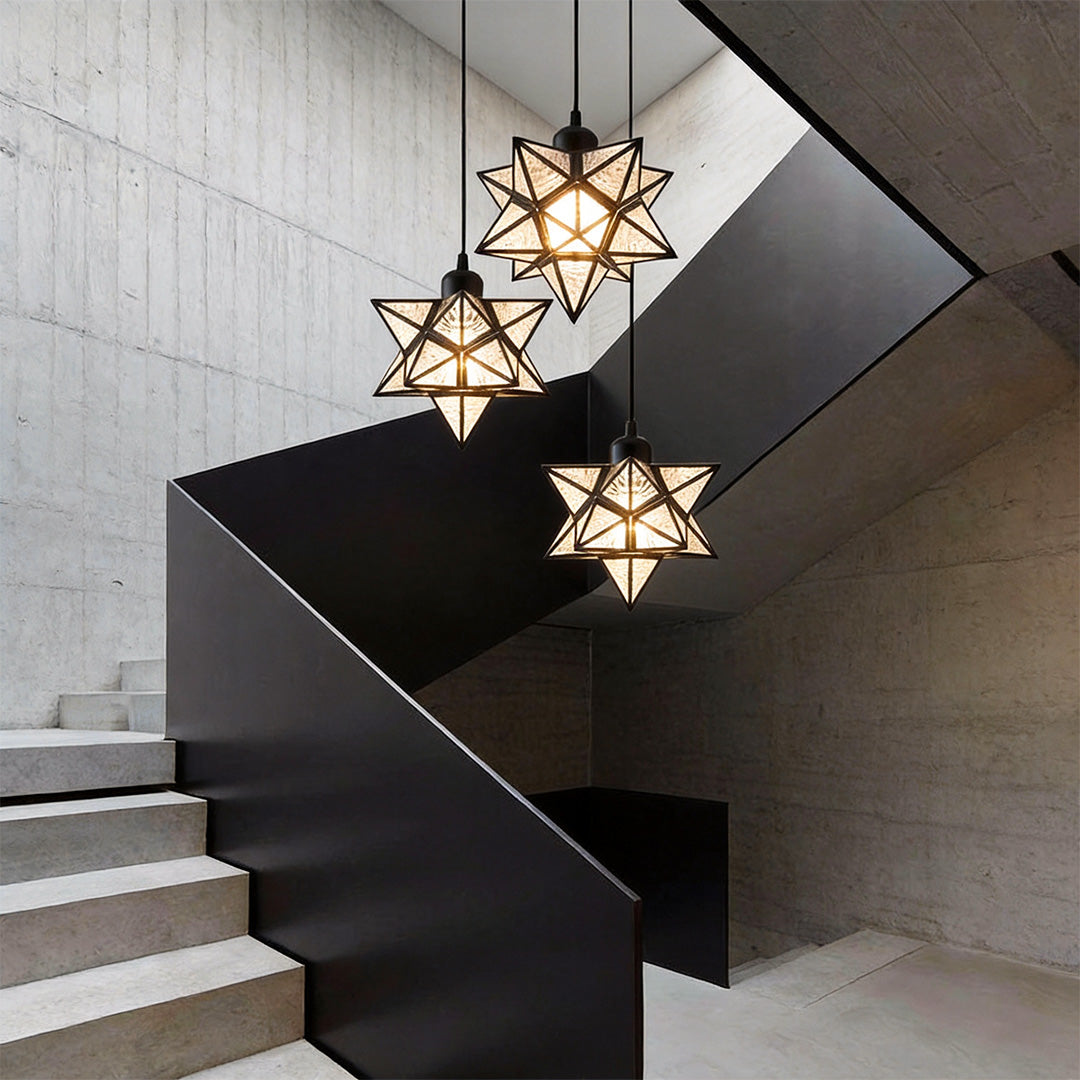 Stylish glass Moravian star pendant light illuminating a contemporary staircase with geometric design.
