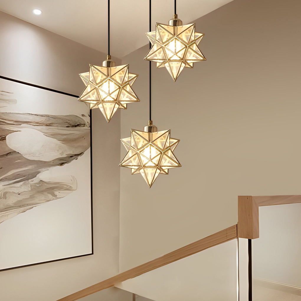 Sophisticated glass Moravian star pendant light adding warmth to a hallway with wooden handrail.