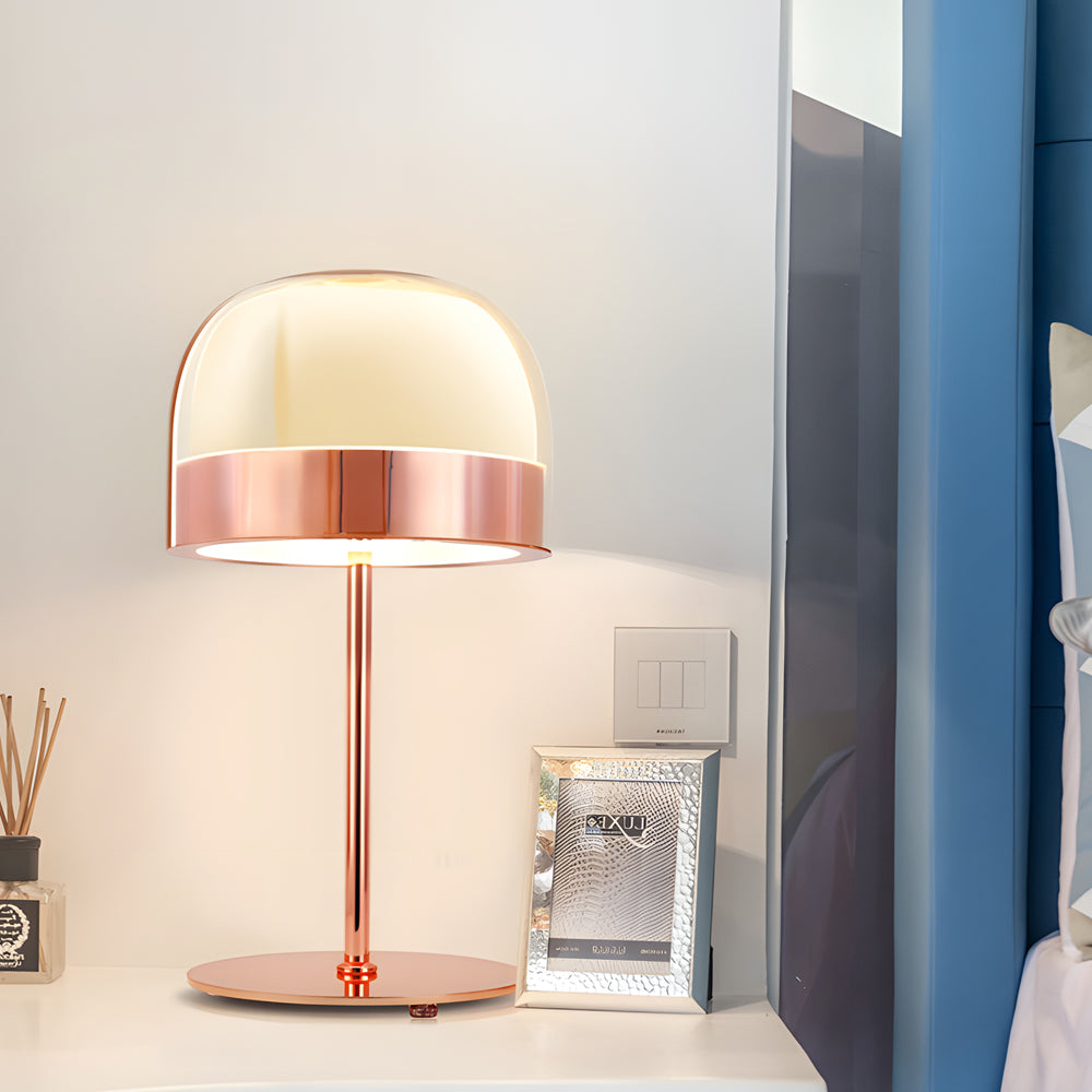 Glass mushroom table lamp with a copper finish, providing warm light in a living room.