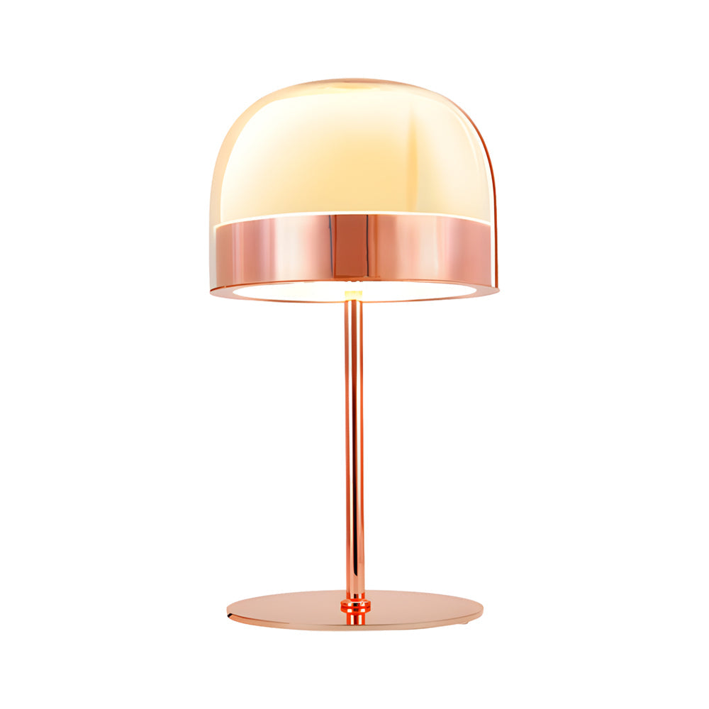 Glass mushroom table lamp with a copper finish, providing soft illumination on a side table.