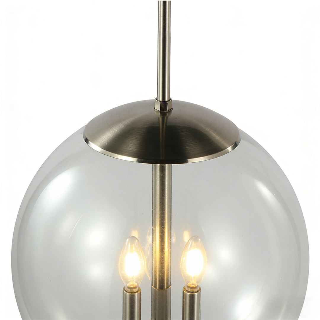 Clear glass orb pendant light with warm bulbs and brushed metal stem, showcasing an elegant glass orb pendant light design for modern interiors.