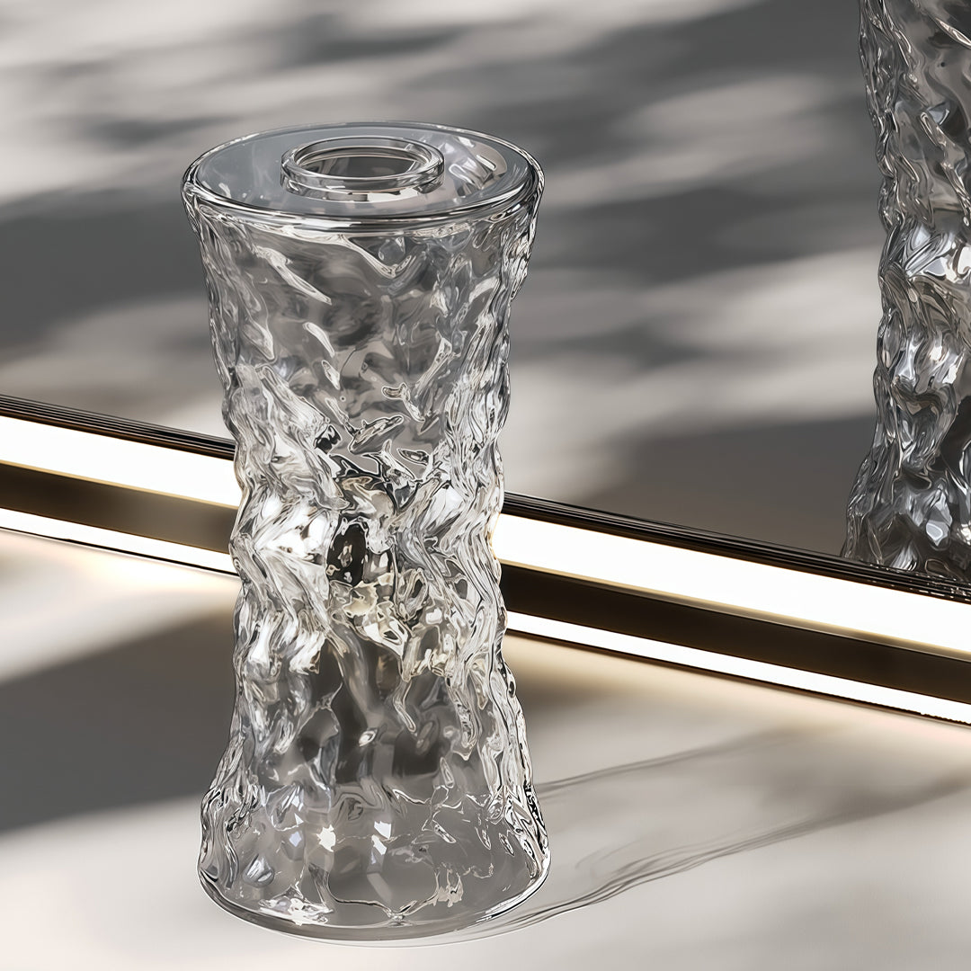 Close-up of glass pendant light fixtures showcasing textured crystal glass craftsmanship and sparkling reflections.