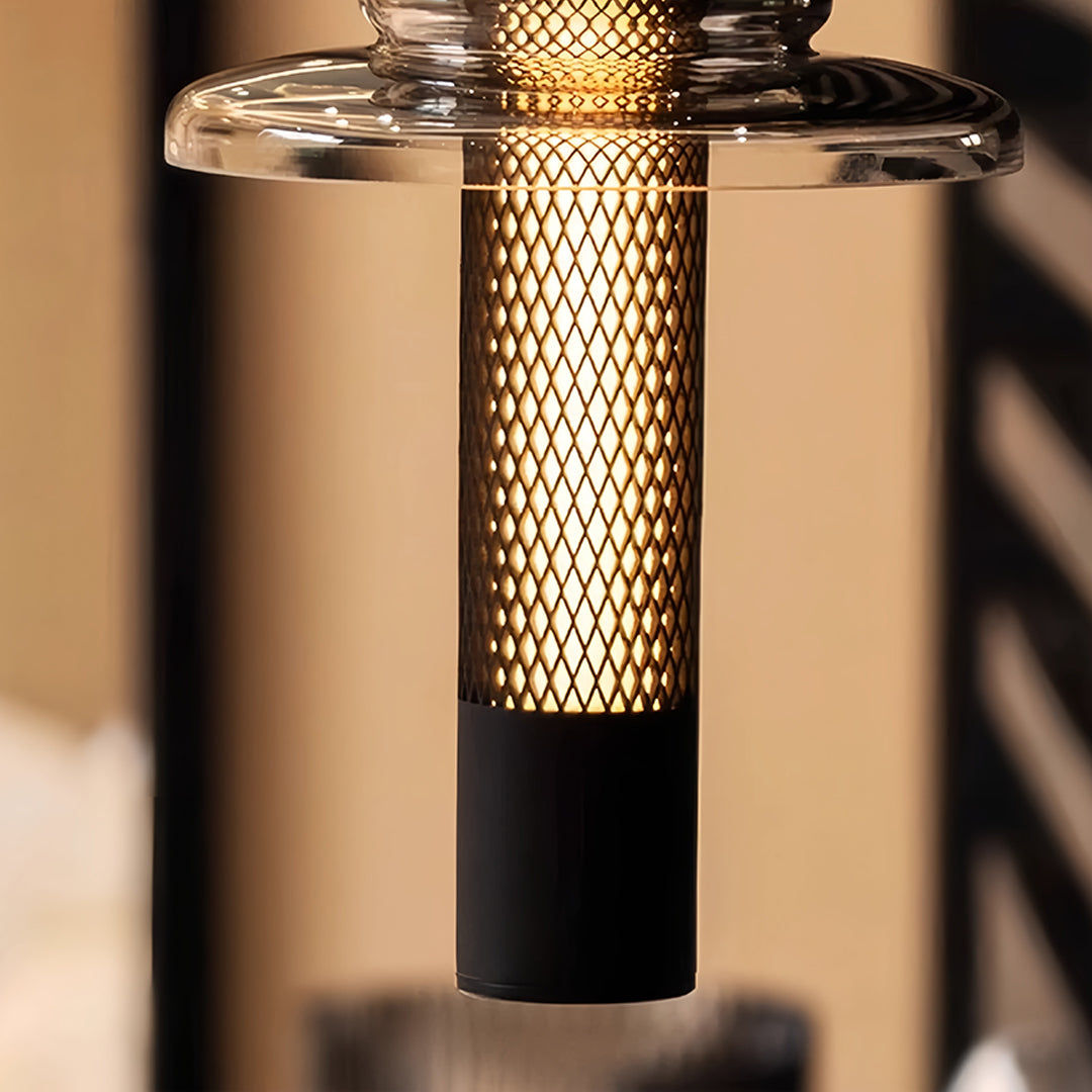 Glass pendant lights with vertical golden mesh cylinder surrounded by black frame accent
