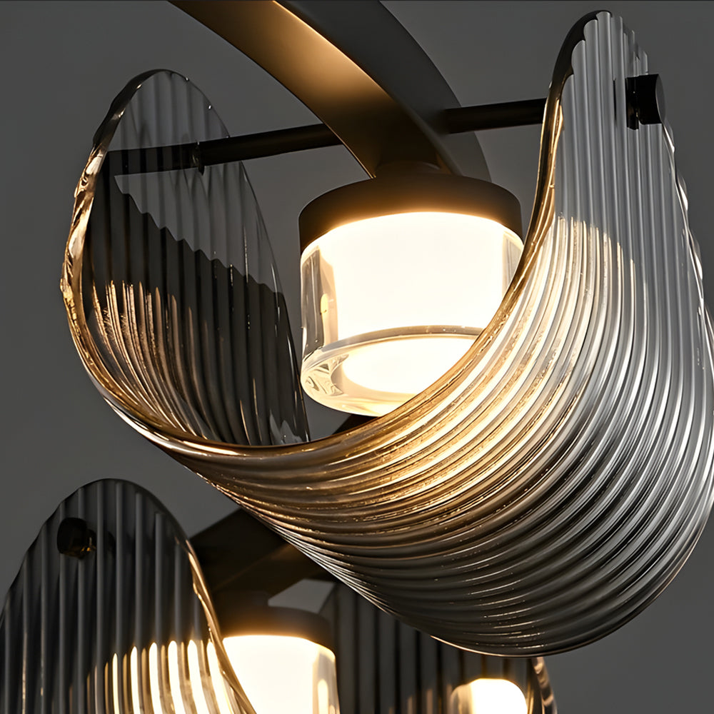 Close-up of a glass ring chandelier showcasing its intricate glass rings and warm glow.