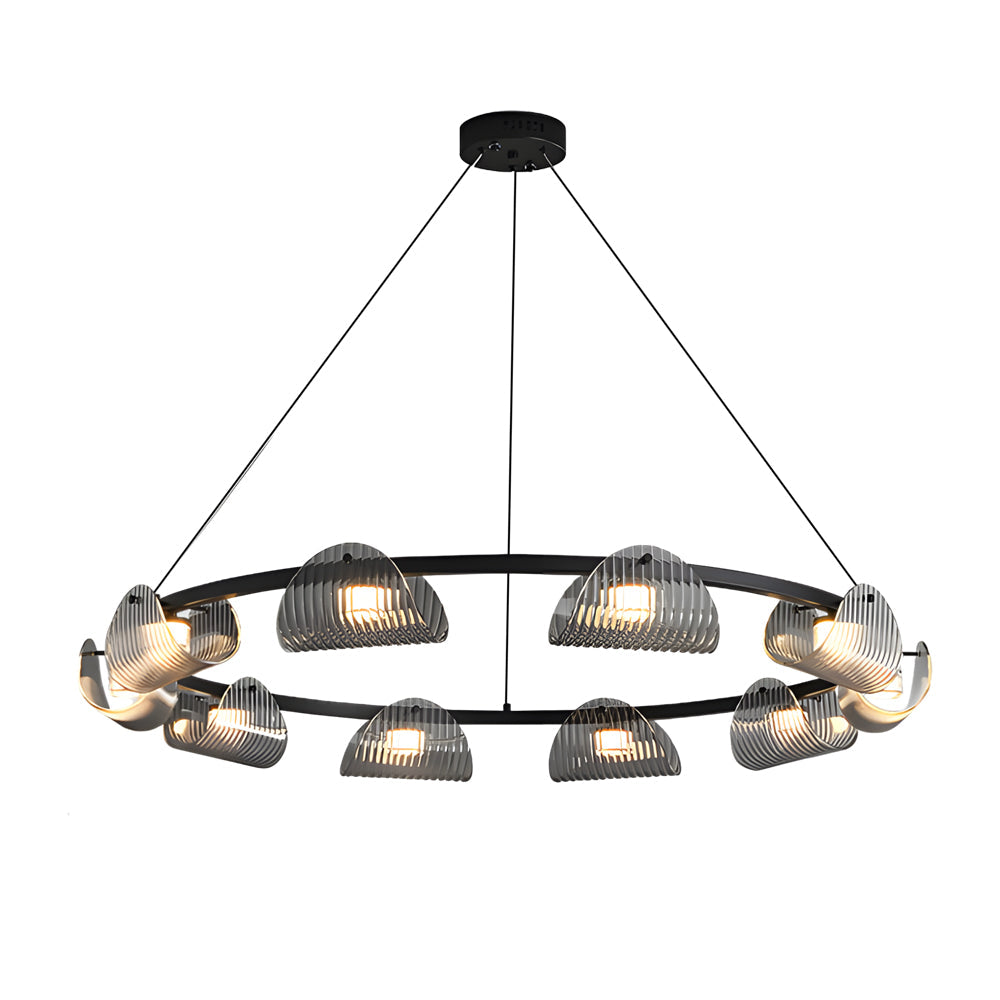 Glass ring chandelier with a modern design, hanging above a minimalist dining table.