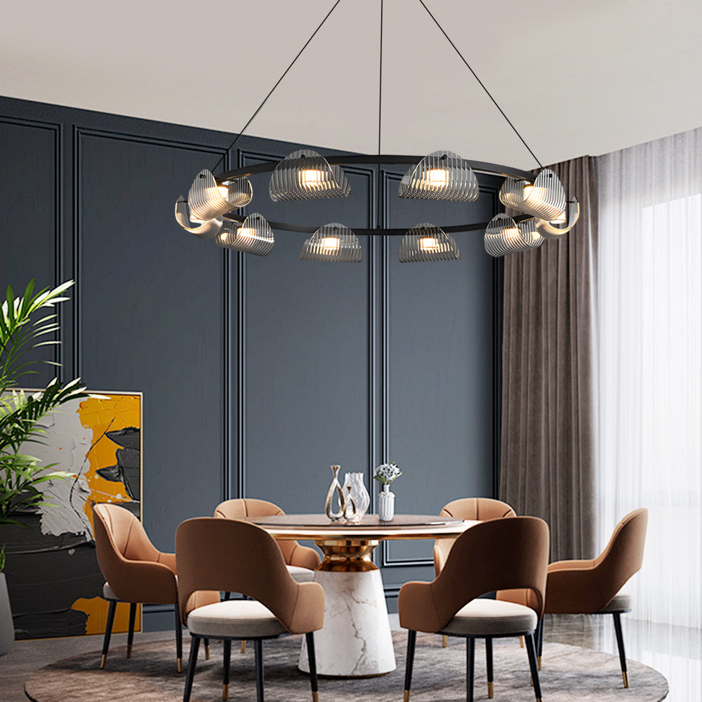 Glass ring chandelier with multiple lights, providing ambient illumination in a modern living room.