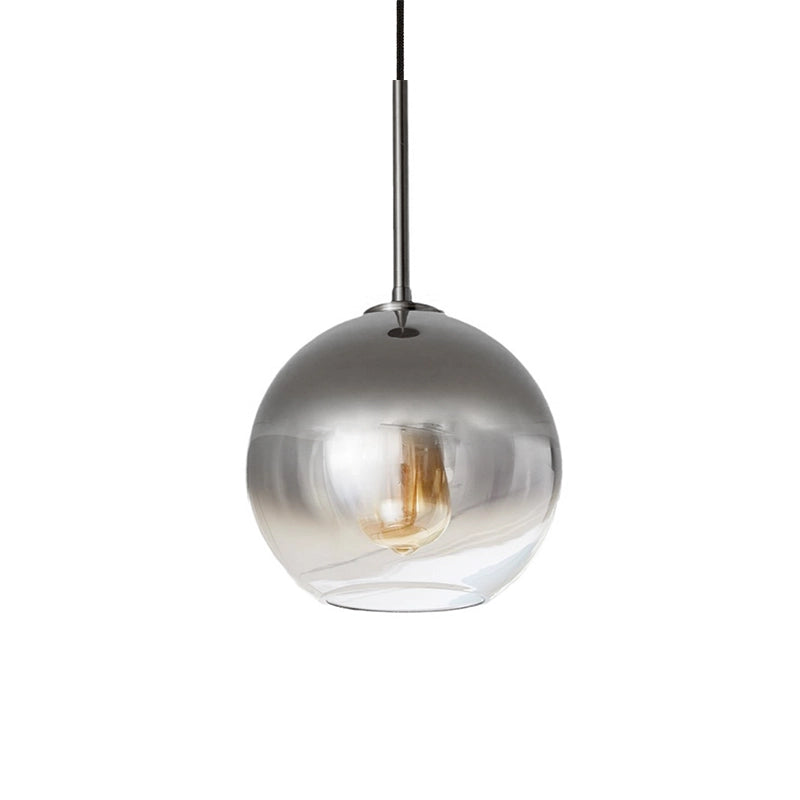 Glass round pendant light with a dark finish and silver glass globe shown on a white background.
