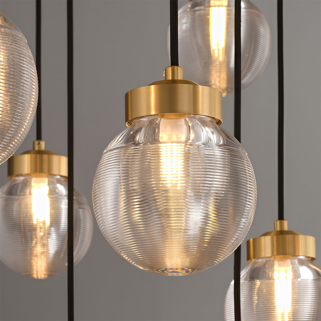 Glass semi flush mount lighting detail showcasing brass hardware and textured glass globe construction