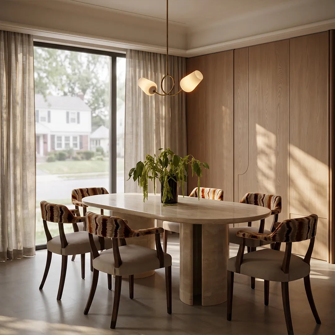 Glass vintage chandelier centered above a round dining table in a softly lit dining room.