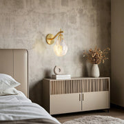 Modern luxury chandeliers style glass wall sconces beside bed with grey textured wall