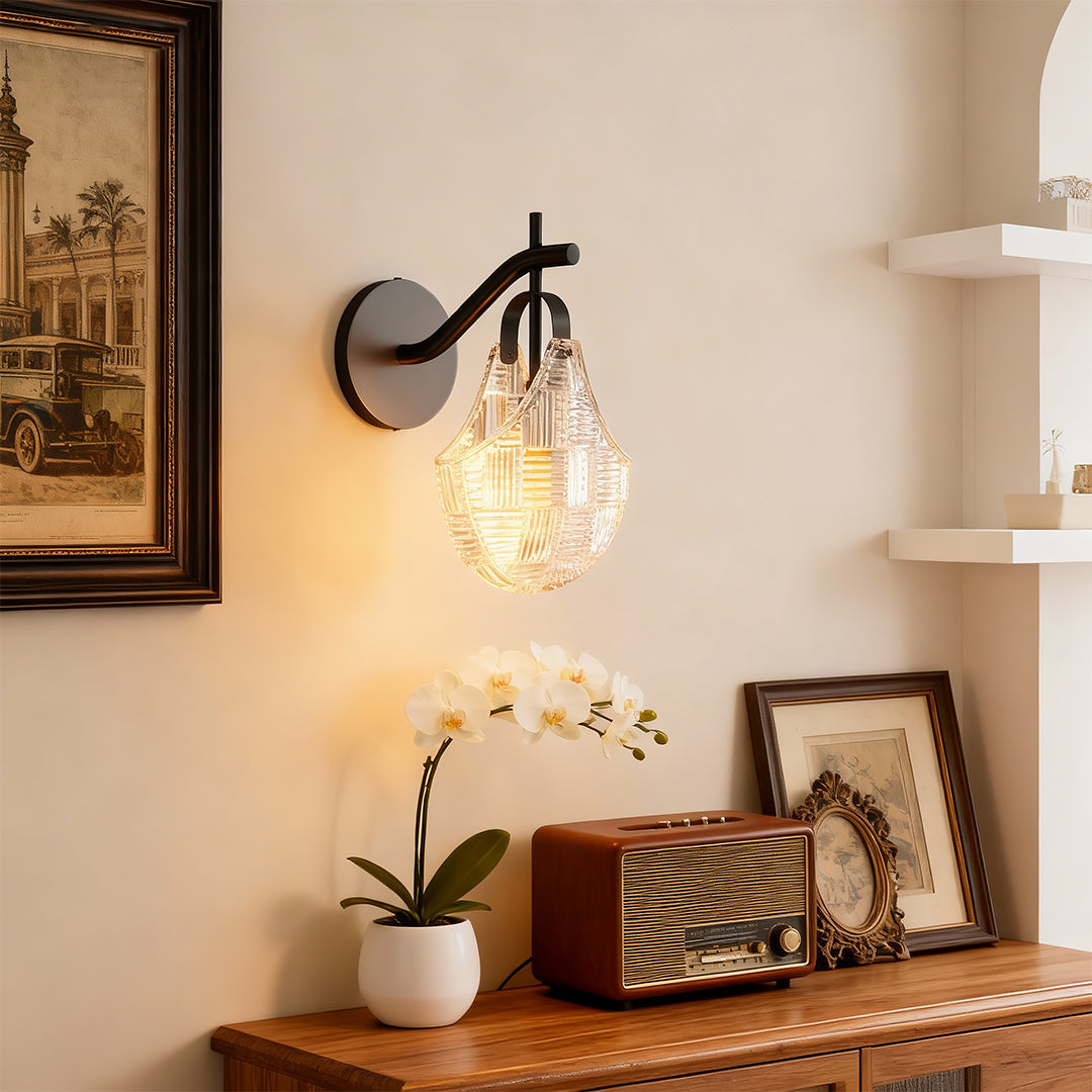 Modern luxury chandeliers inspired glass wall sconces in warm bedroom setting with artwork