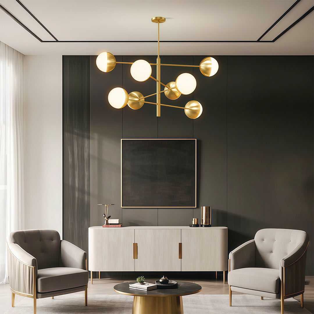 Globe light chandelier illuminating contemporary living room with dark accent wall