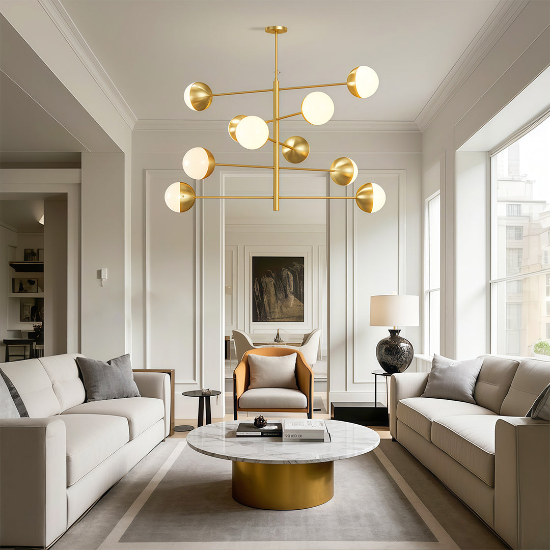 Globe light chandelier lighting contemporary living space with modern furniture and artwork