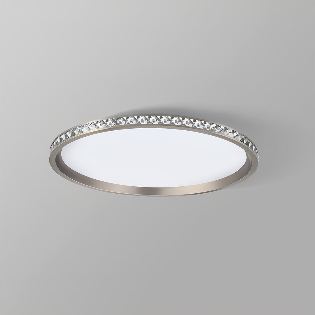 Round flush mount LED light with glowing center and illuminated crystal perimeter ring