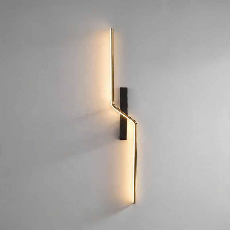 A glowing modern linear wall sconce vertically mounted casting warm light on a plain grey wall