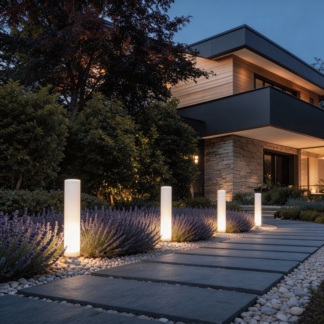 Glowing pillar light enhancing a contemporary house entrance with elegant directional light.