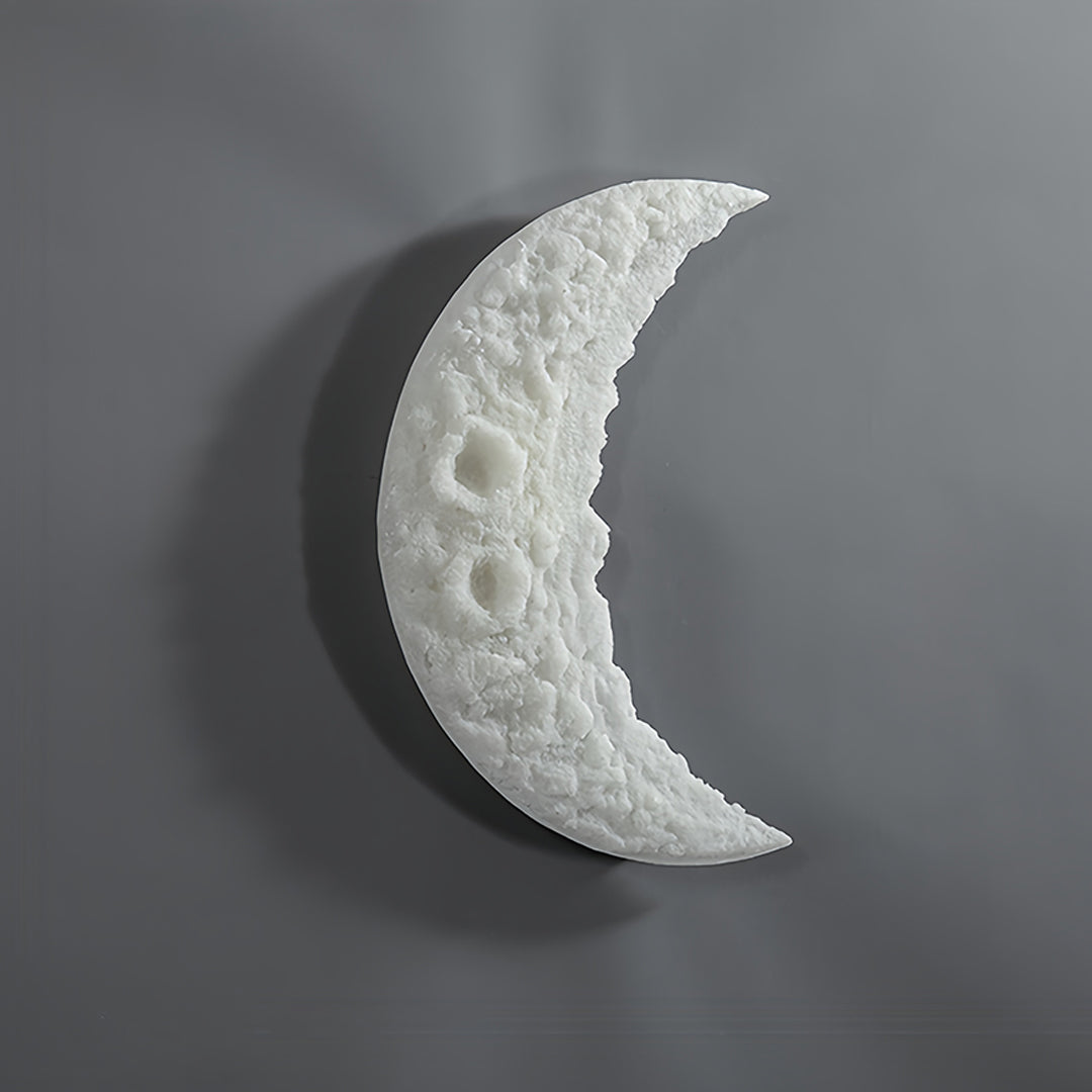 Glowing wall light moon fixture providing soft atmospheric lighting in contemporary space