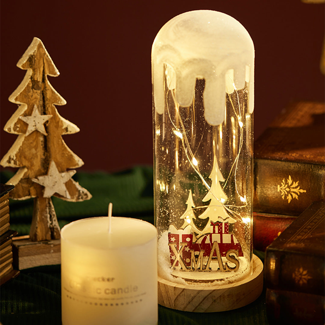 Glowing woodland dome lamp with holiday trees, designed like a small decorative white glass table lamp.