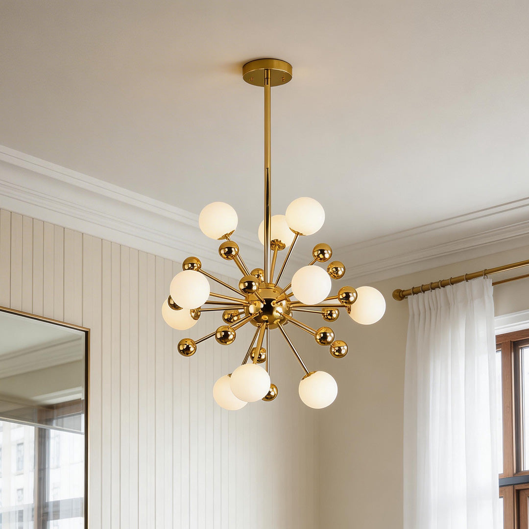 Mid-century modern gold 12 light sputnik chandelier featuring frosted white glass globes in a contemporary room.