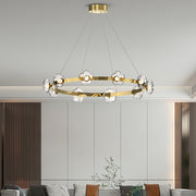 Sophisticated 6 light pendant with gold accents enhancing luxury dining room with circular glass arrangement