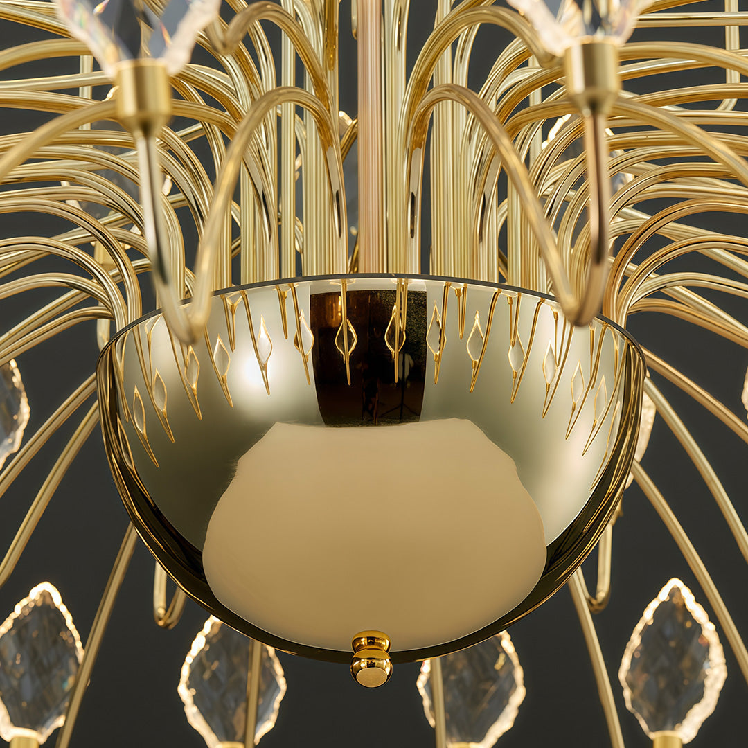 Detailed view of gold base and hanging crystals on gold LED chandelier.