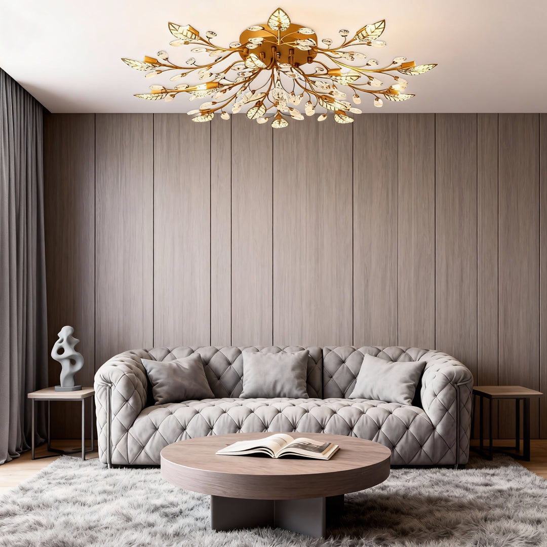 Gold brass branch chandelier paired with modern furniture in a refined residential interior.