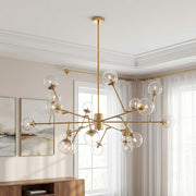 Striking gold bubble sputnik chandelier featuring branching arms and clear glass globes illuminating a modern elegant room.