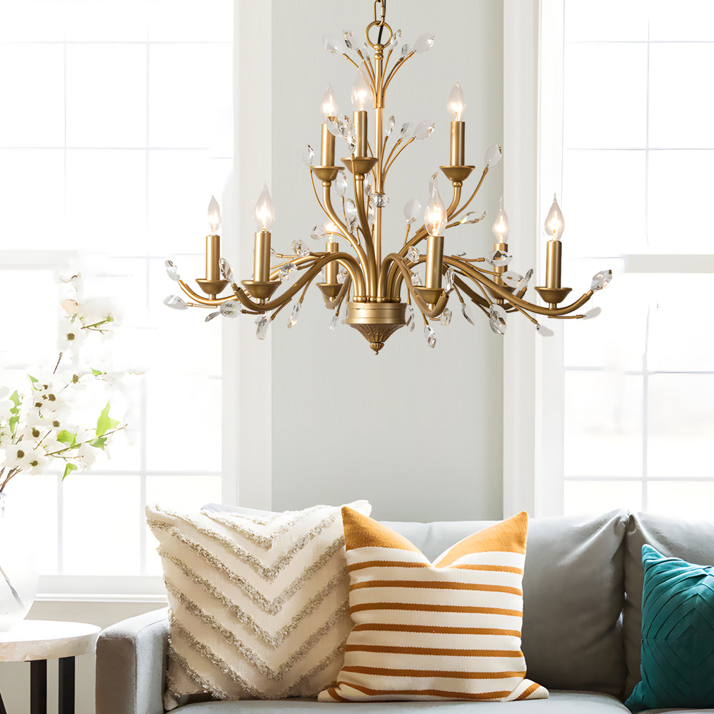 Gold candlestick chandelier with a close-up of its intricate gold and crystal details.