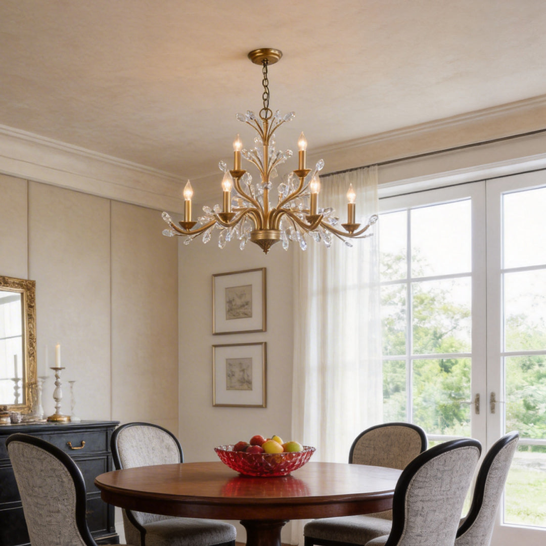 Gold candlestick chandelier with elegant candle-style lights, illuminating a classic dining room.