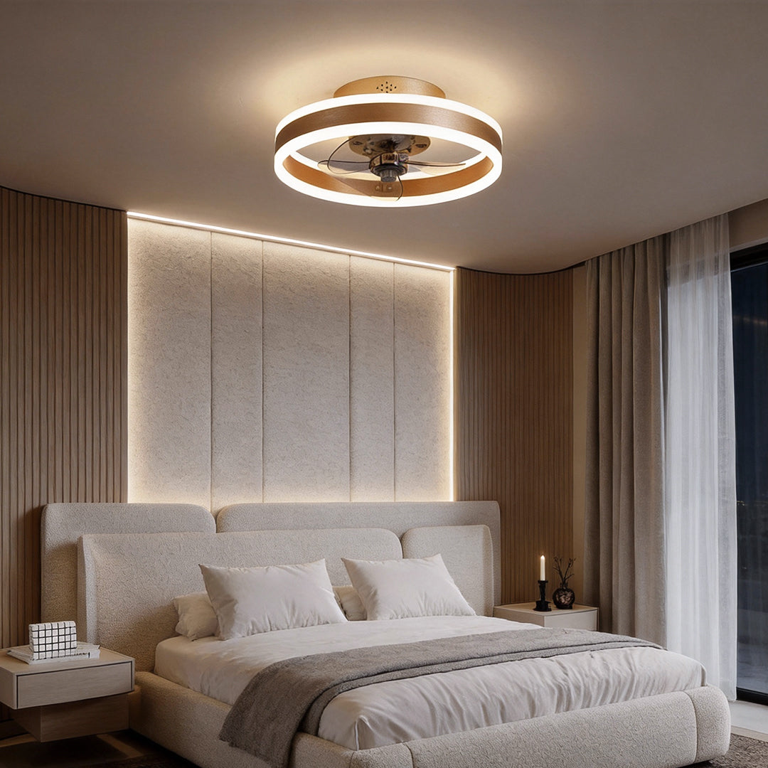 Gold ceiling fan with integrated LED ring light in modern bedroom.