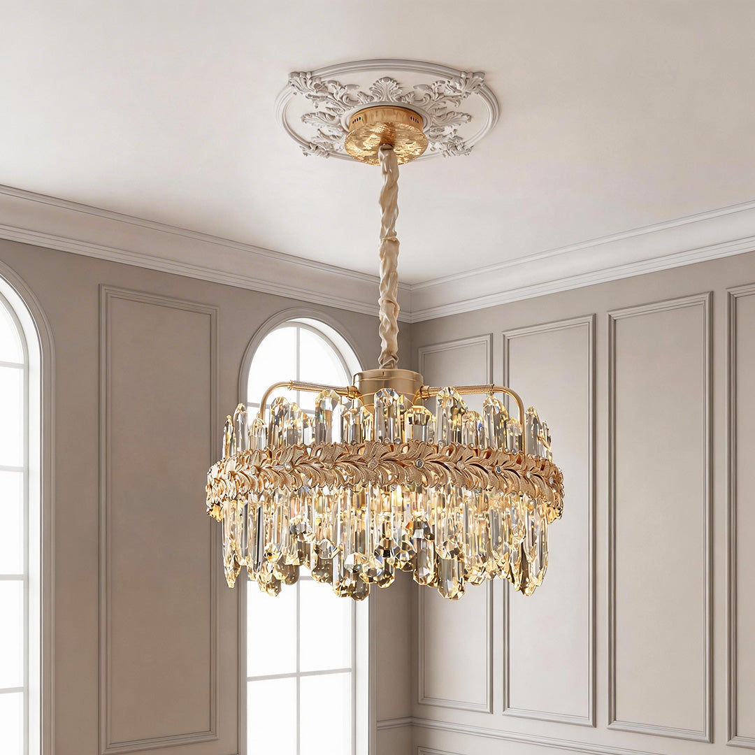 Elegant gold chandelier lamps crystal design featuring an intricate metal band and cascading clear prisms suspended from an ornate ceiling medallion.