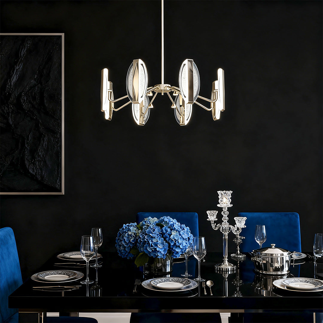 Gold chandelier modern creating dramatic effect in sophisticated dark dining room with royal blue accents