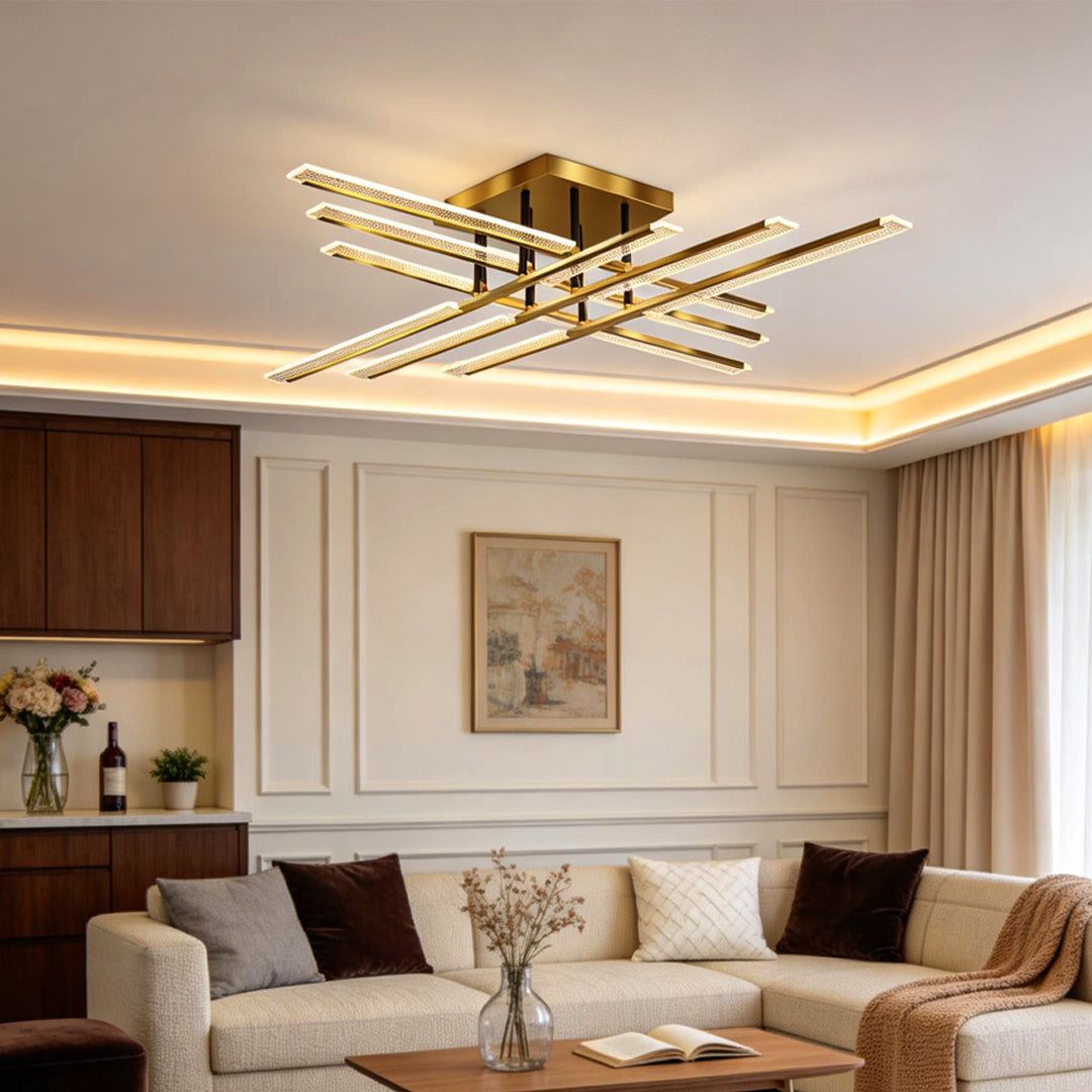 Gold cross ceiling light mounted in a contemporary living space with warm ambient lighting.