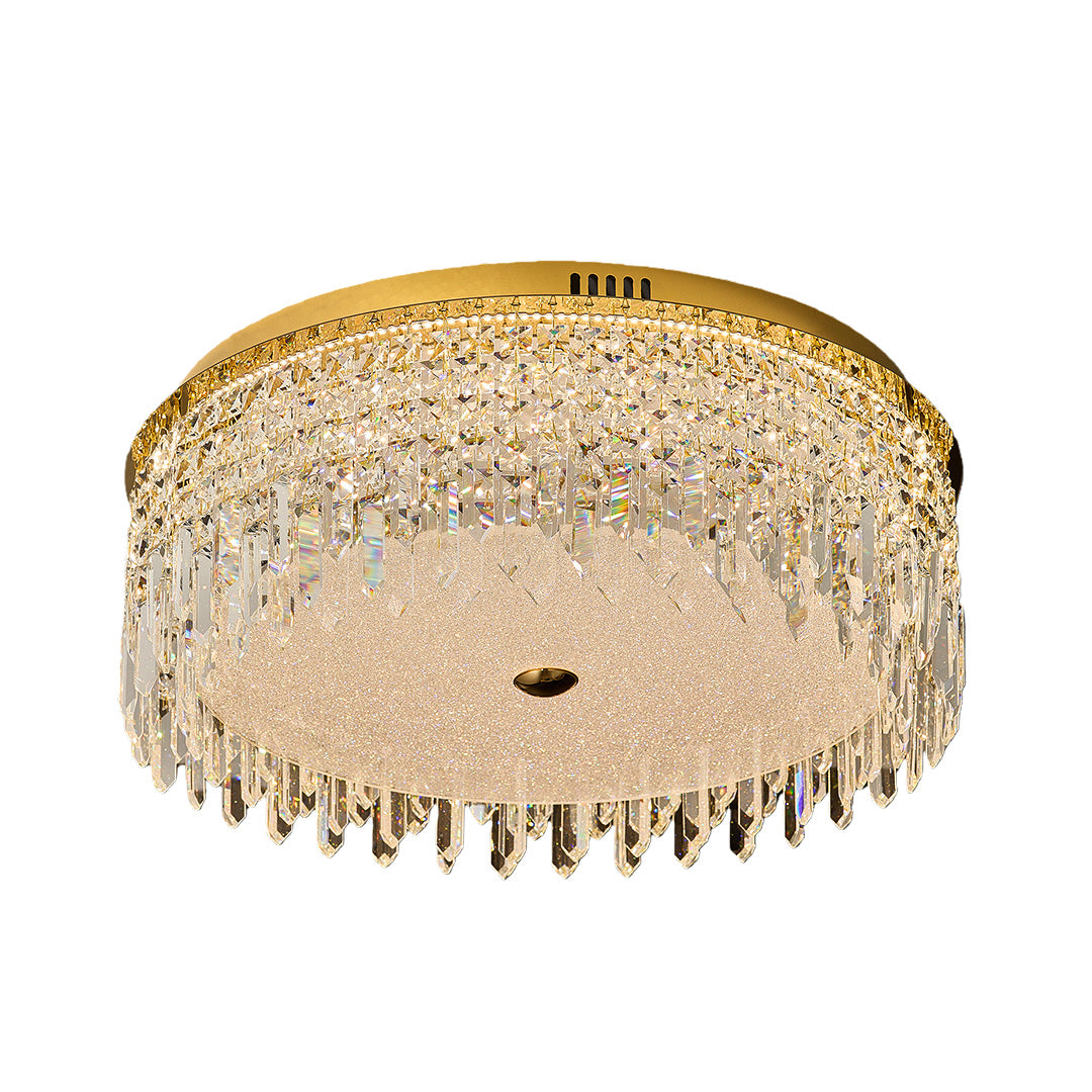 Gold flush mount ceiling light featuring crystal prisms and warm lighting.